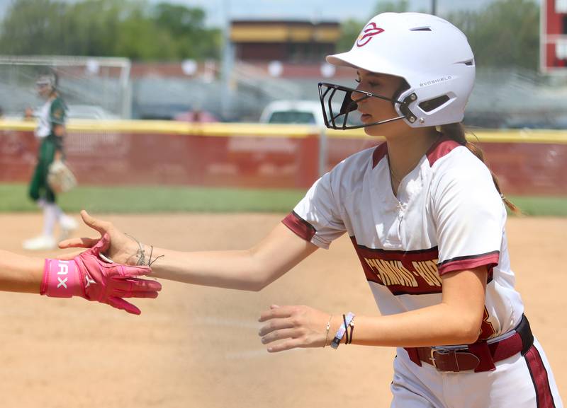 Richmond-Burton’s Jocelyn Hird is greeted after scoring late against North Boone  in IHSA Class 2A Regional Title Game action softball at Richmond-Burton High School in Richmond  on Saturday, May 24, 2025.