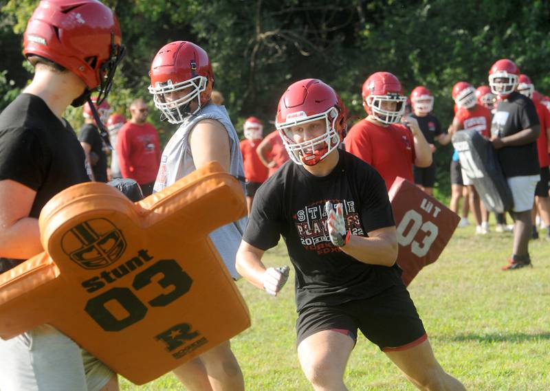 Yorkville's Josh Gettemy works on avoiding blocks during football practice at Yorkville High School on Tuesday, Aug 8, 2023.