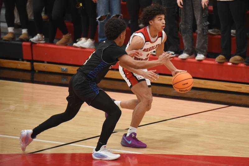 Bradley-Bourbonnais' Dajuan Brown, right, is guarded by Sandburg's Jonah Johnson during a game at Bradley-Bourbonnais Tuesday, Feb. 3, 2026.