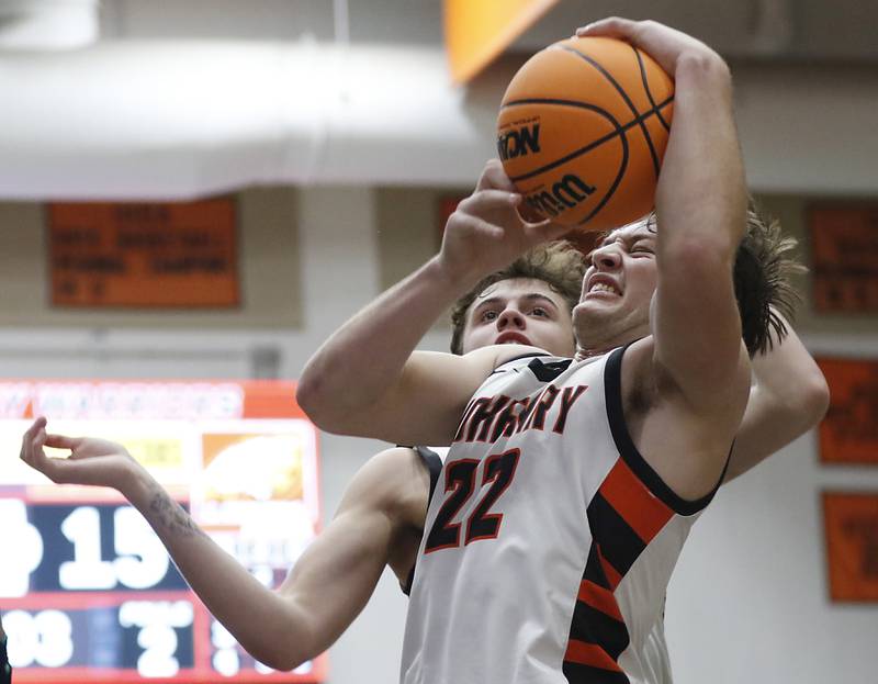 McHenry's Conner McLean grabs a rebound in front of Jacobs' Connor Goehring during an IHSA Class 4A McHenry Regional basketball game on Wednesday, Feb. 26, 2025, at McHenry High School.