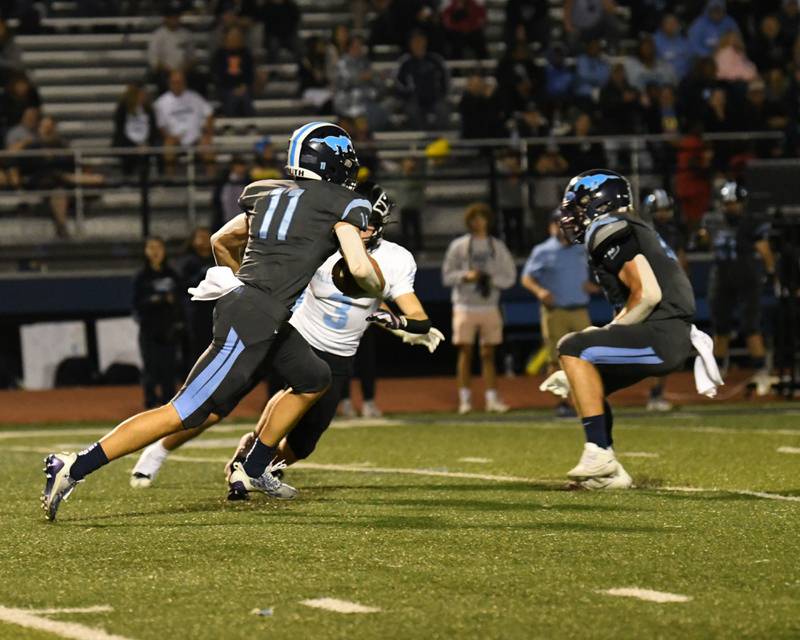 Willowbrook’s Cody Wenkus (11) runs the ball after intercepting the ball while taking on Downers Grove South on Friday Sep. 15, 2023, held at Downers Grove South.