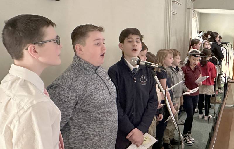 Students sing in the choir during the All Schools Mass on Thursday, Feb. 20, 2025 at St. Patrick's Catholic Church in La Salle.  The Most Reverend Bishop Louis Tylka, Bishop of Peoria gave Mass while announcing a new name for the three schools calling it Carlo Acutis. Last year, the Catholic Diocese of Peoria announced the consolidation of the three schools. Carlo Acutis Canonization will take place on Sunday, April 27, 2025 during the Jubilee of Teenagers in Rome. Acutis is the first millennial saint, representing those born between the early 1980's and the late 1990's. He is celebrated for cataloging miracles and online and managing websites for Catholic organizations.