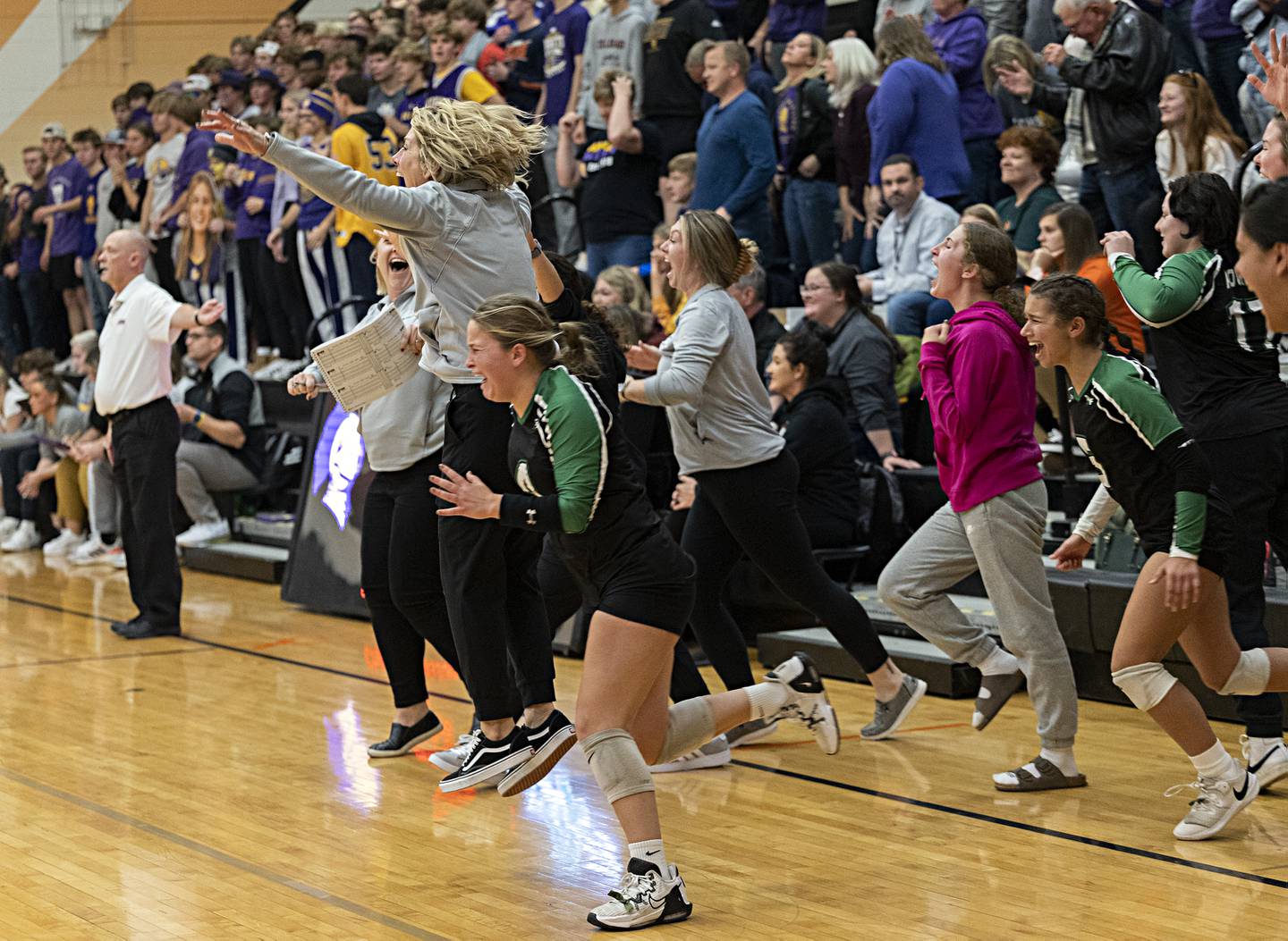 The Rock Falls volleyball bench erupts after beating Chicago Christian in two sets Friday, Nov. 3, 2023 in the class 2A volleyball supersectional in Sandwich.