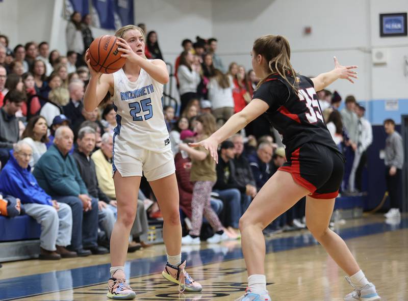 Nazareth's Amalia Dray (25) looks for an outlet during the girls varsity basketball game between Benet and Nazareth academies on Wednesday, Jan. 3, 2023 in La Grange Park, IL.