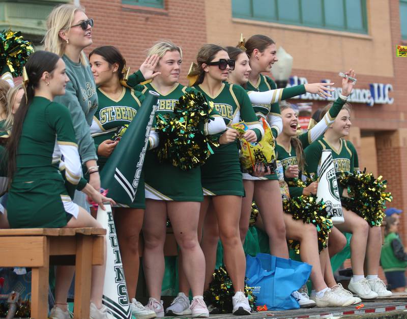 St. Bede cheerleaders ride on a a float during the St. Bede Homecoming parade on Friday, Sept. 27, 2024 downtown Peru.