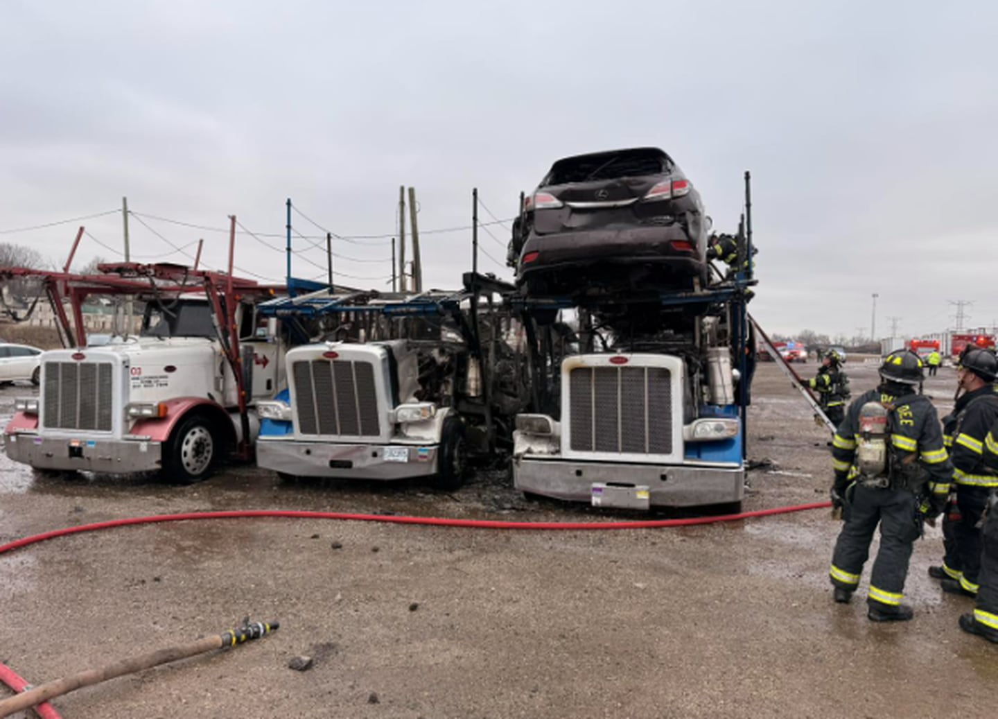 Firefighters with the East Dundee Fire District battle a three semi-truck fire at a storage lot in East Dundee on Dec. 26, 2025.