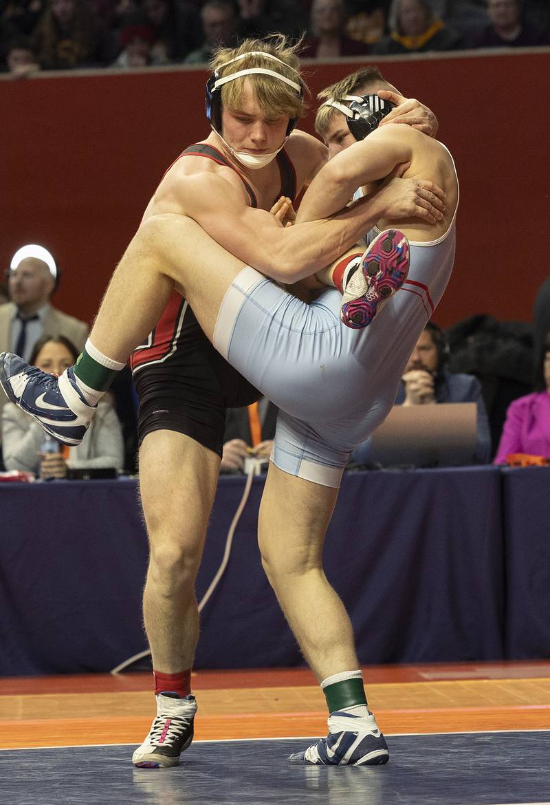 Marian Central’s Jimmy Mastny (right) and Orion’s Maddux Anderson compete in the 190 pound weight class of the 1A state individual wrestling finals Saturday, Feb. 22, 2025, at State Farm Center in Champaign.