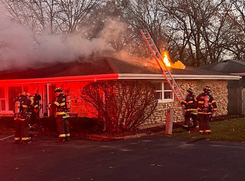 Firefighters work to extinguish a fire in the 500 block of West Street on Nov. 21.