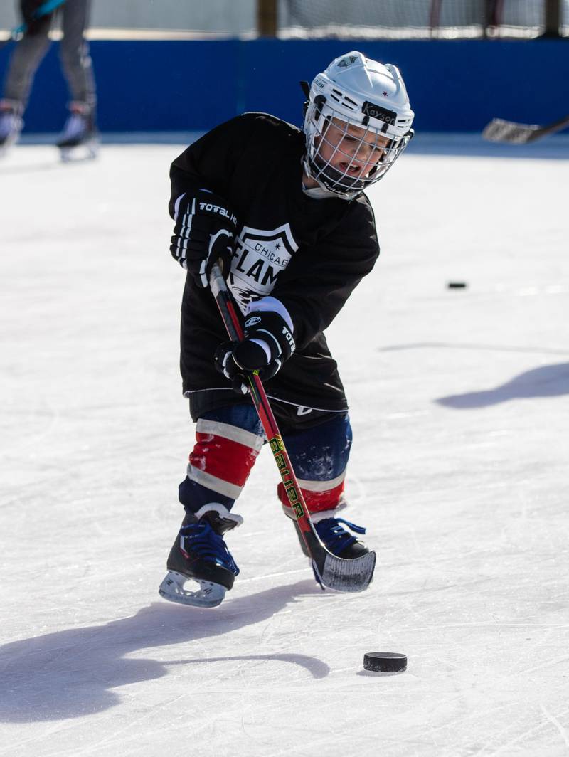 Kayson Schumacher passes the hockey park during the Wheaton Park District's Ice-A-Palooza at the Central Athletic Complex in Wheaton on Saturday, Feb. 4, 2023.