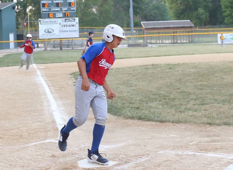 Frostbyte MSP Rangers Evan Lopez scores the teams first run against Thrush Sanitation Red Sox during the Ottawa Little League baseball (12U) City Championship on Friday, June 23, 2023 at Varland Park in Ottawa.