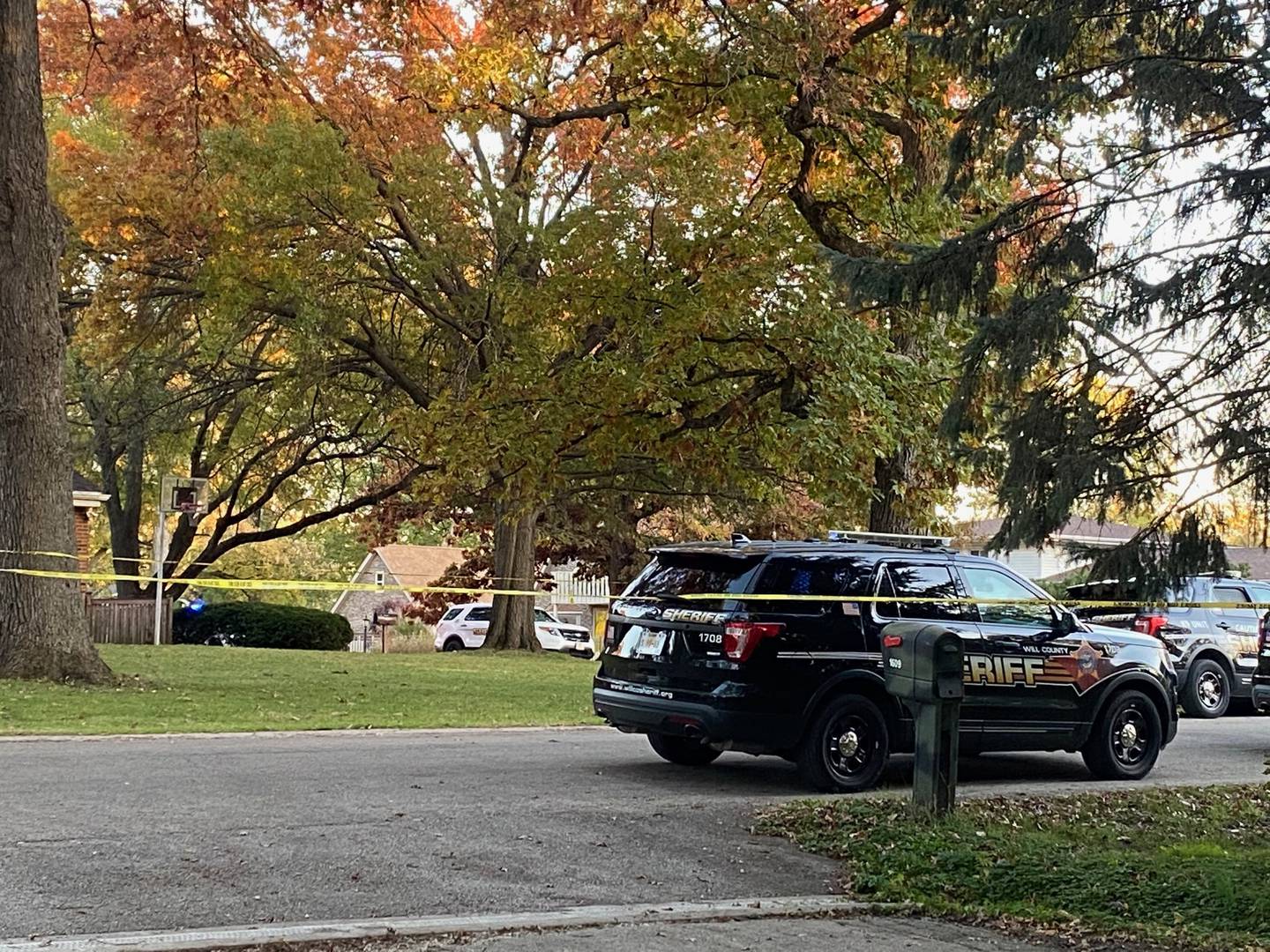 The Will County Sheriff's Office blocked off Middletree Road after deputies gunned down a man as he stabbed his grandfather to death Saturday afternoon, according to police.
