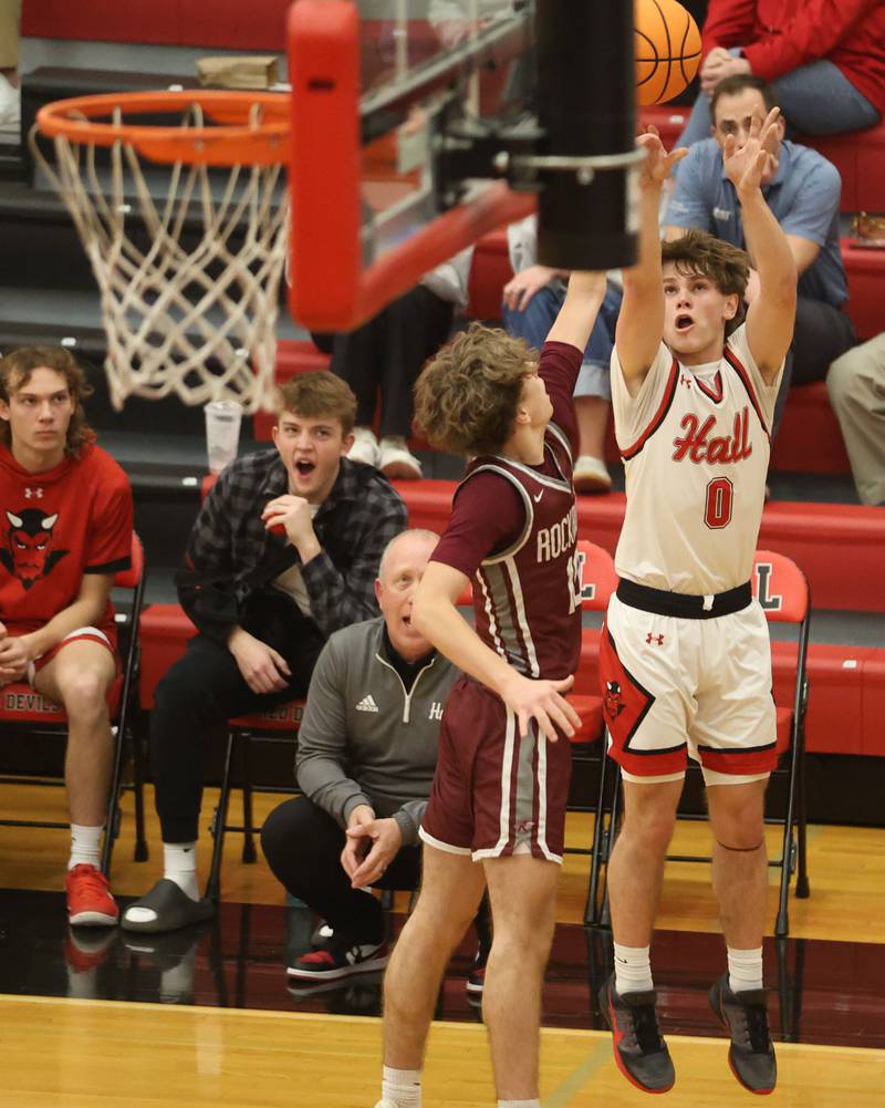 Hall's Greyson Bickett lets go of a jump shot over Rockridge's Rylan Daly during the Class 2A Regional quarterfinal game on Monday, Feb. 23, 2026 at Hall High School.