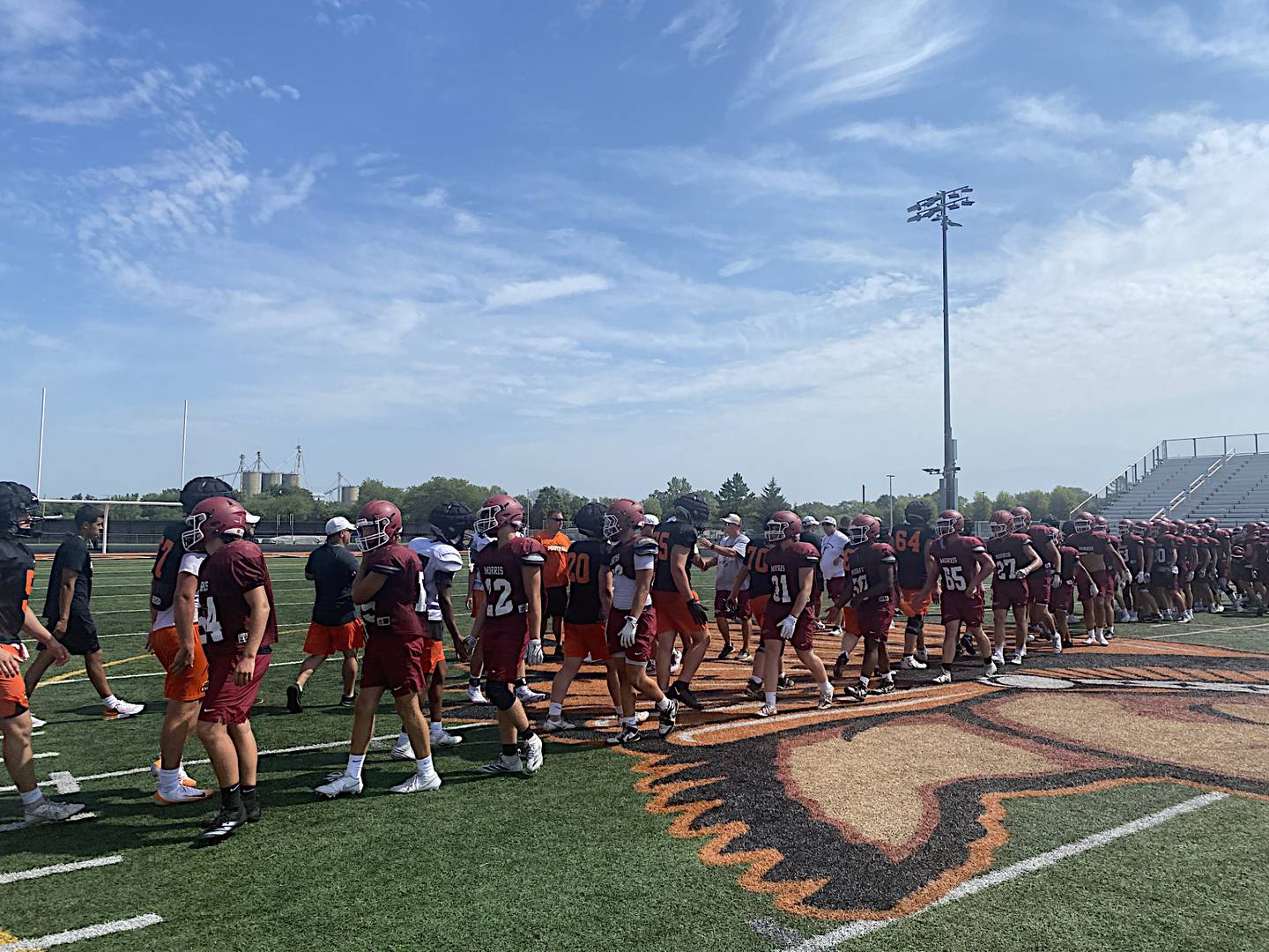 The Morris and Minooka football teams shake hands after Thursday's joint practice in Minooka.