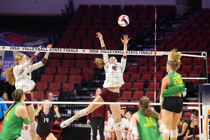 Prairie Ridge's Adeline Grider reaches to block a hit during the Wolves' loss in two sets, 25-20, 25-18, in the IHSA Class 3A State semifinals on Friday, Nov. 14, 2025.