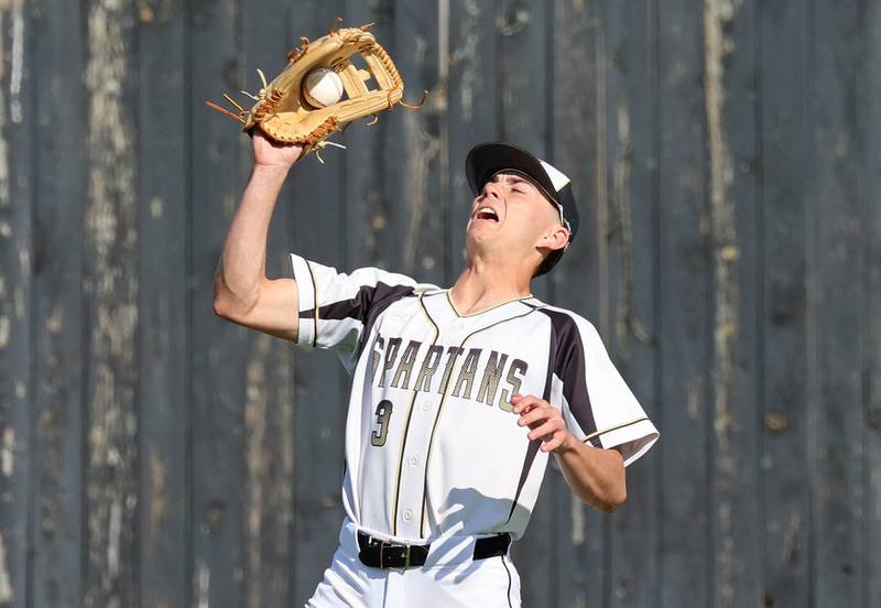 Sycamore's Benjamin Anderson catches a flyball Tuesday, April 28, 2026, during their game against Kaneland at the Sycamore Community Sports Complex.