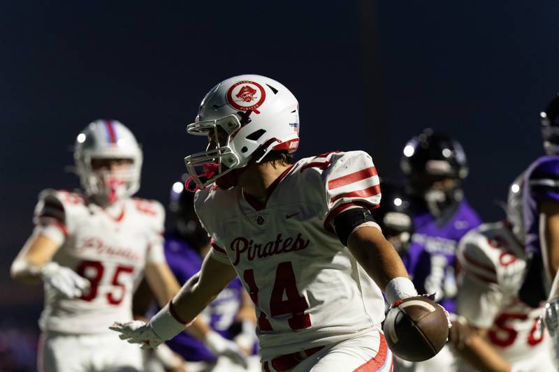 Ottawa's Archer Cechowicz celebrates a touchdown during the Pirates' win over Plano Friday.