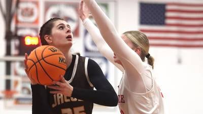 Olivia Schuster shows off post moves as Jacobs rolls past Dundee-Crown