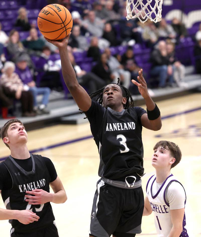 Kaneland's Marshawn Cocroft gets a layup in front of Rochelle's Cohen Haedt Tuesday, Feb. 3, 2026, in their game at Rochelle High School.