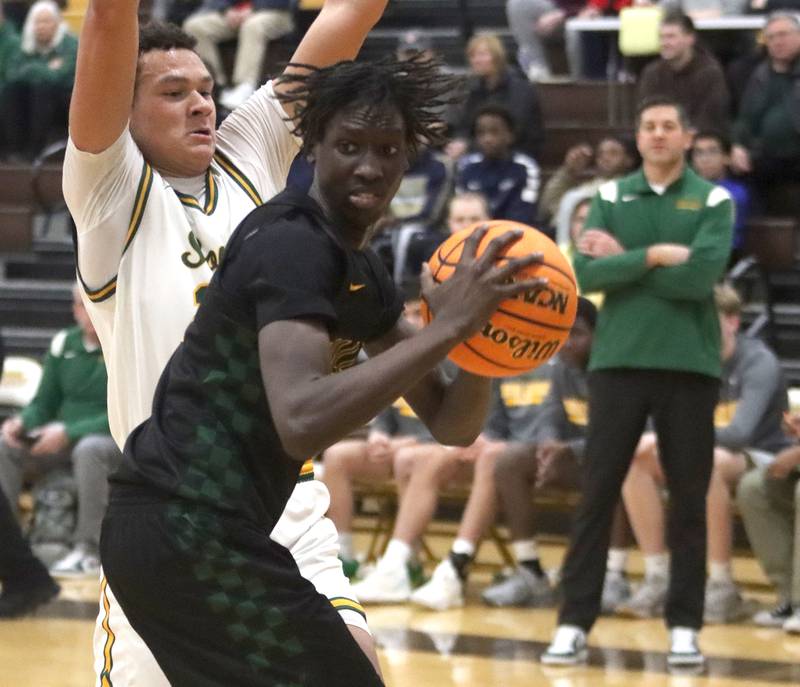 Crystal Lake South’s Cooper Buelna defends Waubonsie Valley’s Moses Wilson, right, during Hinkle Holiday Classic varsity boys basketball tournament title game action on Friday, Dec. 27, 2024 at Jacobs High School in Algonquin.