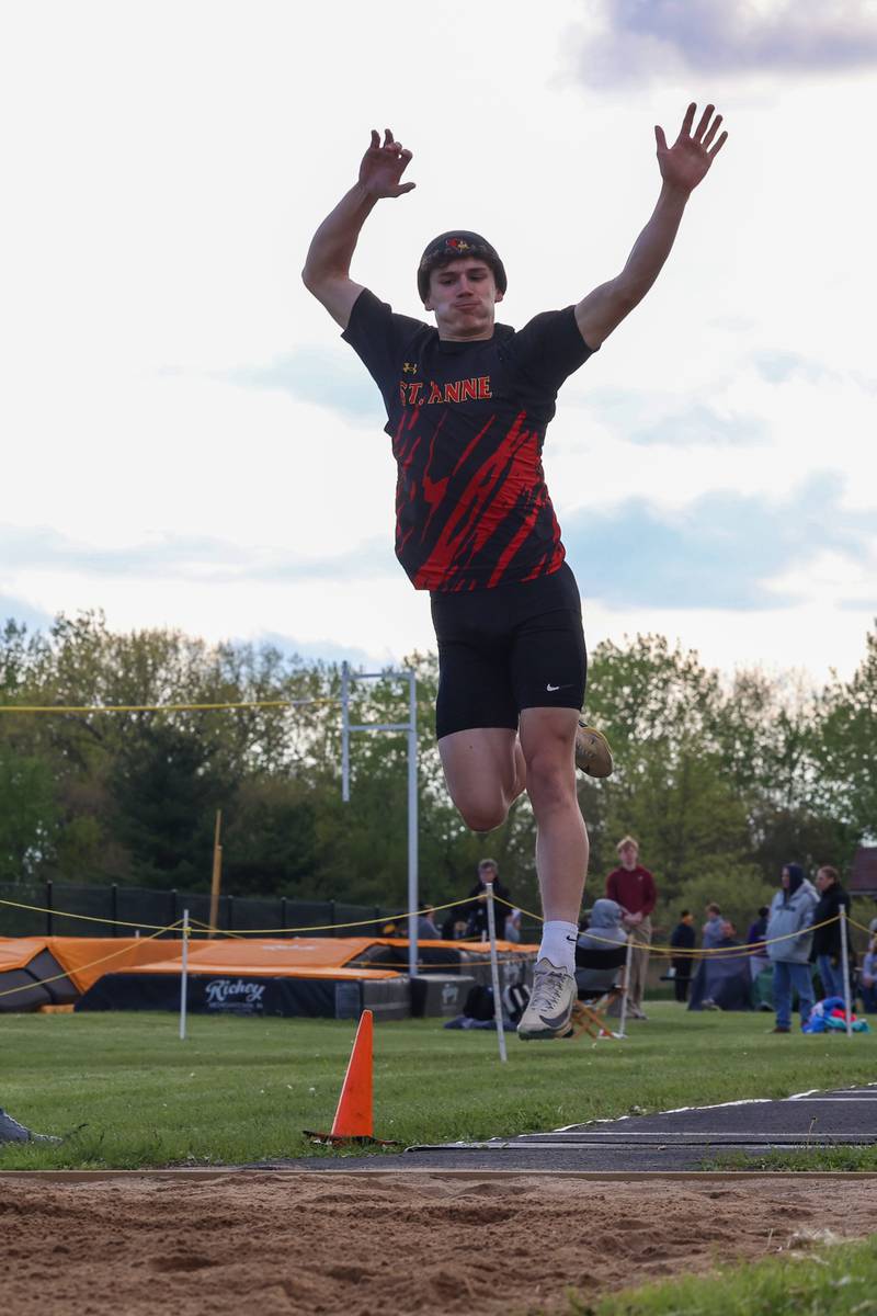 St. Anne's Aden Pinson flies into the sand during long jump at the Herscher Track Invite on Friday, May 1, 2026.