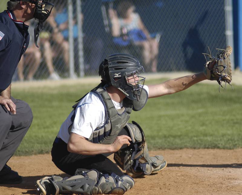 Newman catcher grabs a pitch. Marquette traveled to Newman's Larry Ybarra field to play a game on Friday, May 16, 2025