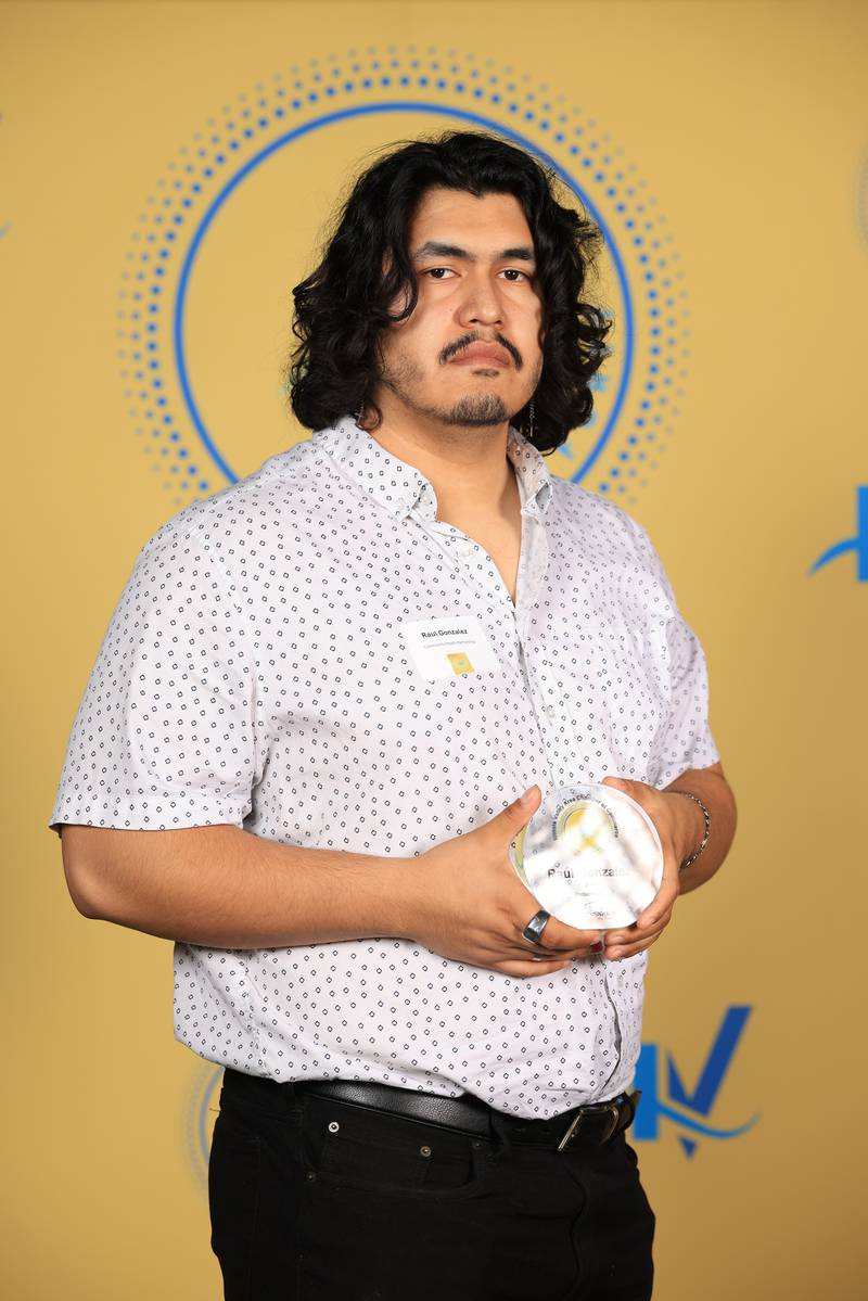 Raul Gonzalez poses with his 40 Under Forty award during the Illinois Valley Chamber of Commerce Champions of Change Awards Night on Thursday, April 10, 2025 at the Westclox Event Center in Peru.