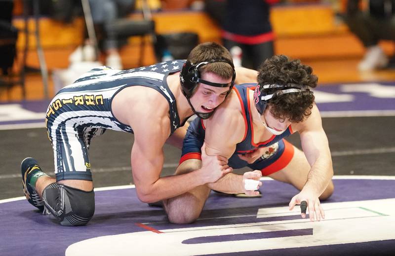 Yorkville Christian’s Grason Johnson (left) competes in a 138 pound championship match against St. Rita’s Enzo Canali during the Reaper Classic Wrestling meet at Plano High School on Saturday, Dec 9, 2023.