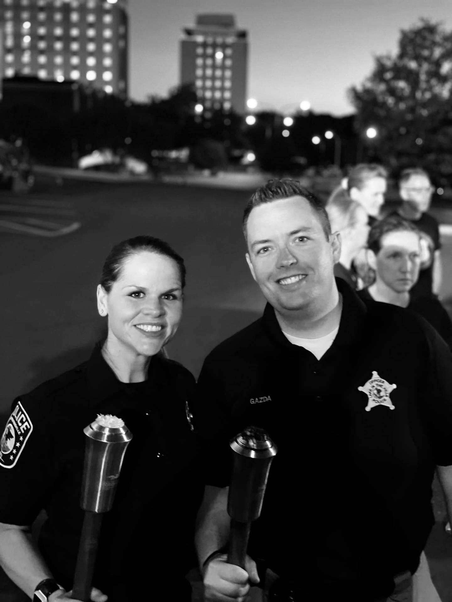 Officer Kara Burroughs (left) of Carpentersville Police Department and Officer AJ Gazda (right) of Lake in the Hills Police Department during the Law Enforcement Torch Run for Special Olympics in 2022.