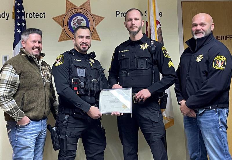 Pictured from left are Undersheriff Bobby Richardson, Deputy Cooper, Sergeant Lechowicz and Commander Jason Langston.