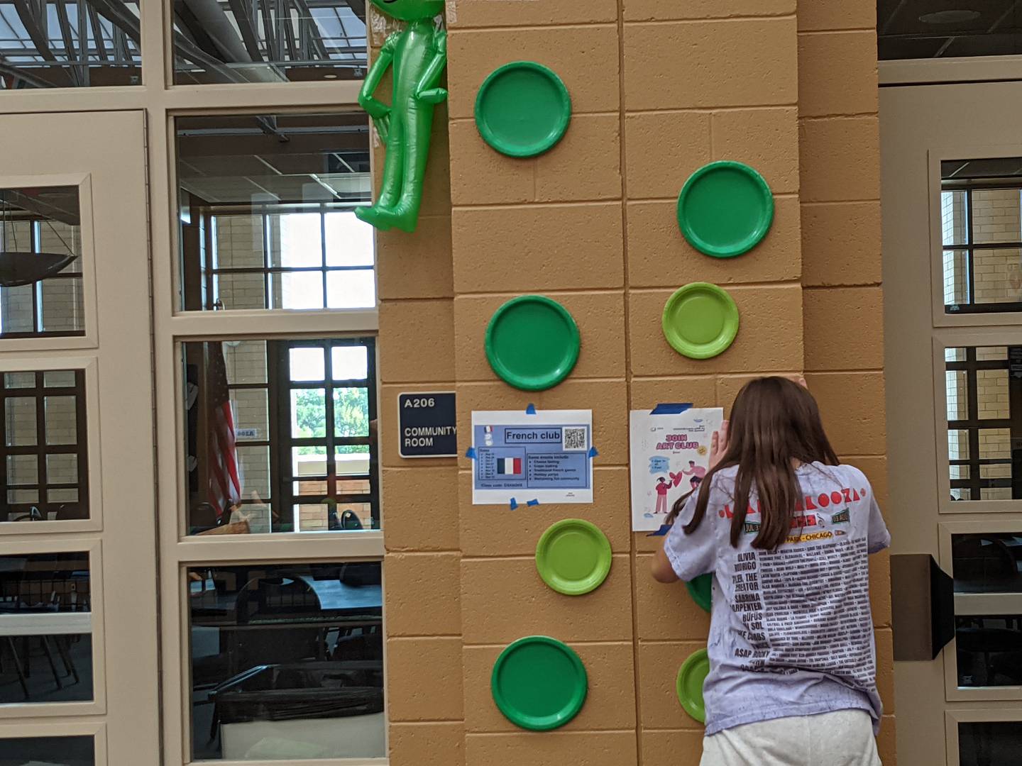 At Oswego East High School, sophomore Ellie Truesdale and her fellow students kicked off homecoming week by decorating the hallways of the school on Sept. 28, 2025.