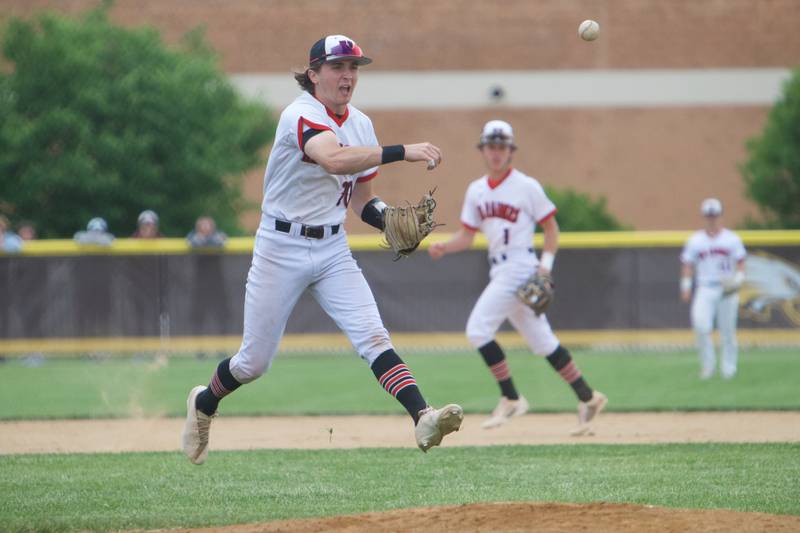 Huntley's Harout Meyer makes the running throw for the out against McHenry at the Class 4A Sectional Final on June 4, 2022 in Algonquin.