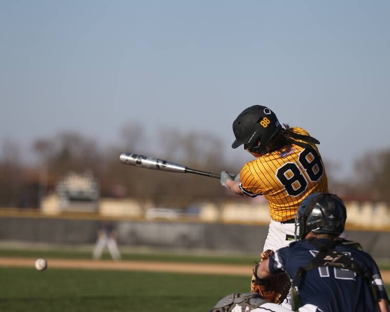 Joliet West's Angelo Spoto (88) swings away during varsity baseball game between Oswego East at Joliet West.  April 10, 2023.