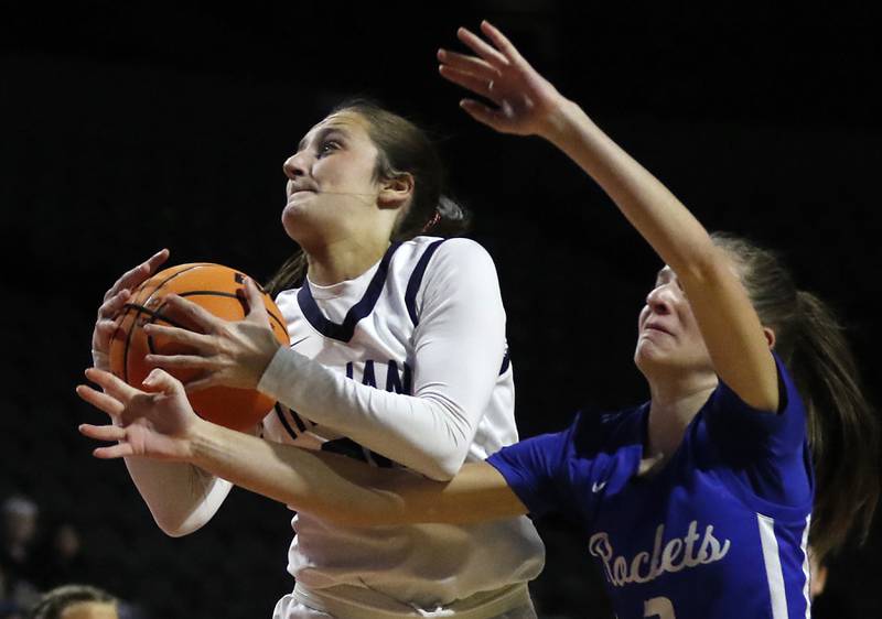 Cary-Grove's Samantha Skerl grabs a rebound in front of Burlington Central's Julia Scheuer during a Fox Valley Conference basketball game  on Tuesday, Jan. 14, 2025, at Now Arena in Hoffman Estates.