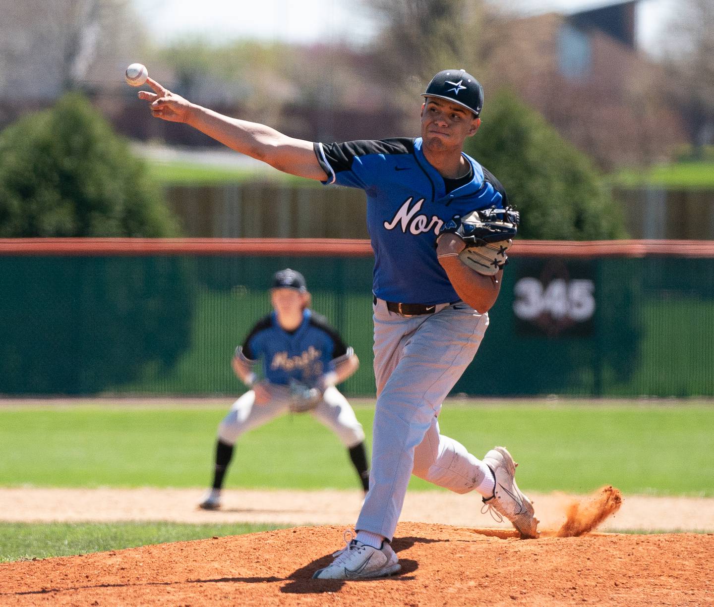 St. Charles North's Anthony Estrada (23) delivers a pitch against St. Charles East during a baseball game at St. Charles East High School on Saturday, May 7, 2022.