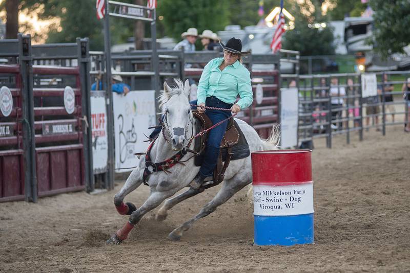 Kari Diedrich rounds the second in the barrel racing event Tuesday, August 16, 2022 during the Next Level Bull Riding tour at the Whiteside County fair. Competitors raced against the clock while rounding three barrels with the winner posting the best time.