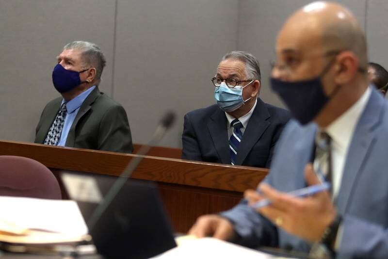 McHenry County State's Attorney's Office prosecutor Ashur Youash speaks during a hearing for defendants Colin Scott, left, and Michael Penkava, center, Thursday, Dec. 16, 2021, at the Michael J. Sullivan Judicial Center in Woodstock.