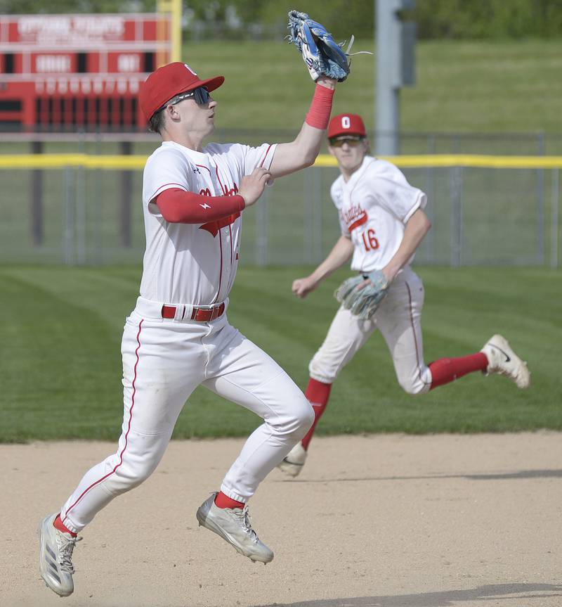 Ottawa 3ed baseman Jacob Rosetto jumps to snag a high hopper against LaSalle Per Monday at Ottawa.