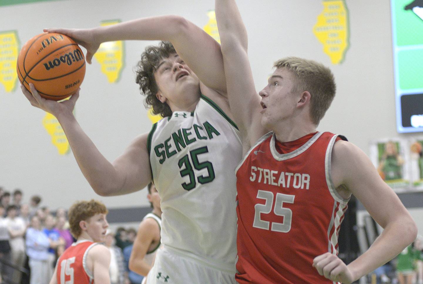 Streator’s Joseph Hoekstra attempts to block at shot by Seneca’s Zeb Maxwell in the 2nd period Tuesday at Seneca.