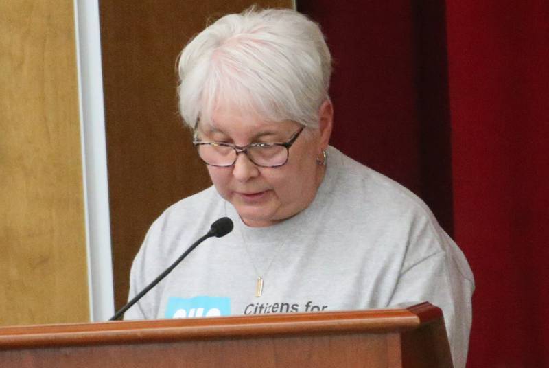 Paula Bailey speaks to the Illinois Health Facilities and Services Review Board during a public hearing regarding OSF St. Elizabeth Hospital's plans to reduce services on Tuesday, June 10, at Central Intermediate School in Ottawa.