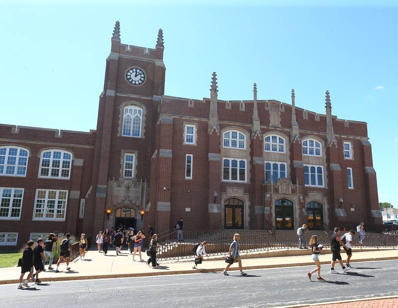 Students exit La Salle-Peru Township High School on the first day of classes on Wednesday, Aug. 10, 2022 in La Salle.