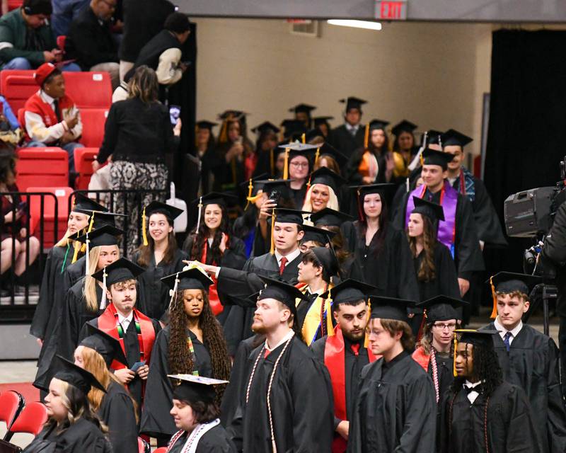 Northern Illinois University graduates file in for the graduation ceremony on Saturday May 9, 2026, held at the Convocation Center in Dekalb.