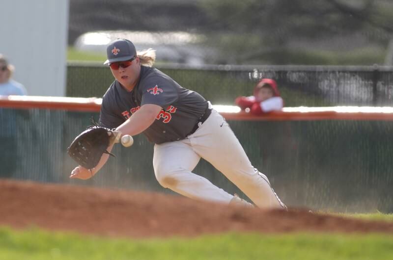 St. Charles East’s James Brennan goes after a ground ball during a home game against Wheaton North on Monday, May 15, 2023.