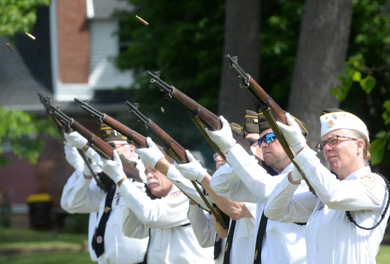 Veterans fire their rifles during the gun salute as part of the Oregon VFW's Memorial Day service at Riverside Cemetery in Oregon on Monday, May 26, 2025.