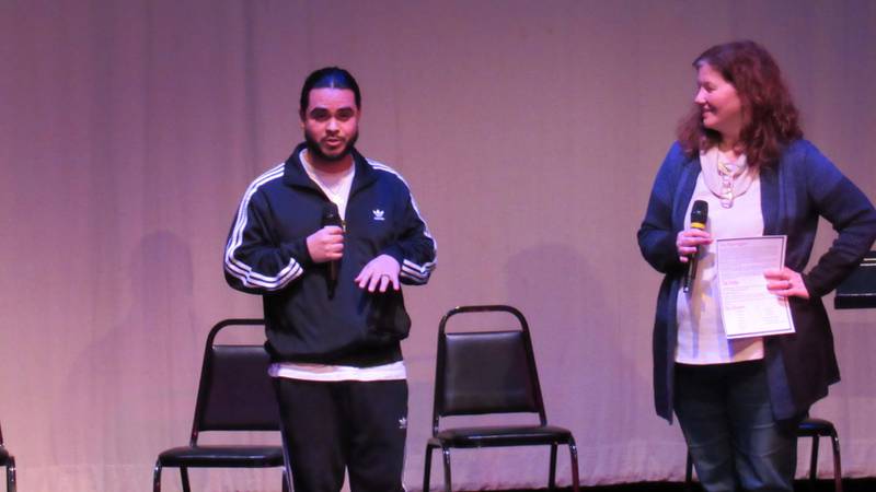 Joliet Uxmar Torres (left) and Lori Carmine (right), park manager at the Billie Limacher Bicentennial Park Theatre in Joliet, are seen onstage at Bicentennial Park's "Playwrights & Poets Fest" on Jan. 20. Torres is coordinating Bicentennial Park's first open mic night for poetry on April 5.