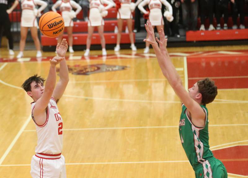 Ottawa's Lucas Farabaugh lets go of a shot over L-P's Jameson Hill on Friday, Feb. 6, 2026 in Kingman Gymnasium at Ottawa High School.