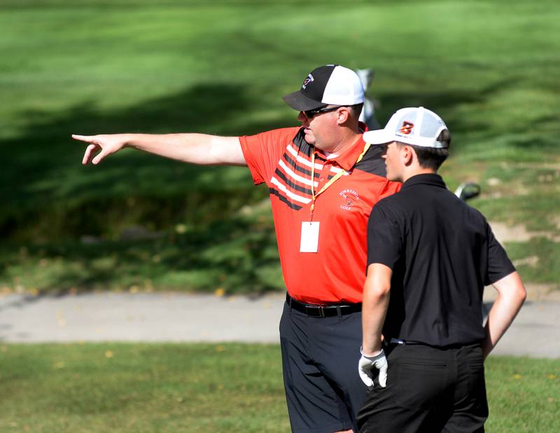 Forreston coach Matt Hanley talks with a Byron golfer at Wolf Hollow Golf Course in Lena during the 1A Pearl City Regional on Wednesday, Oct. 1, 2025.
