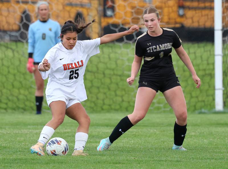 DeKalb's Evelyn Guerra Cruz tries to keep the ball away from Sycamore's Elizabeth Goff  Thursday, May 7, 2026, during their game at Sycamore High School.