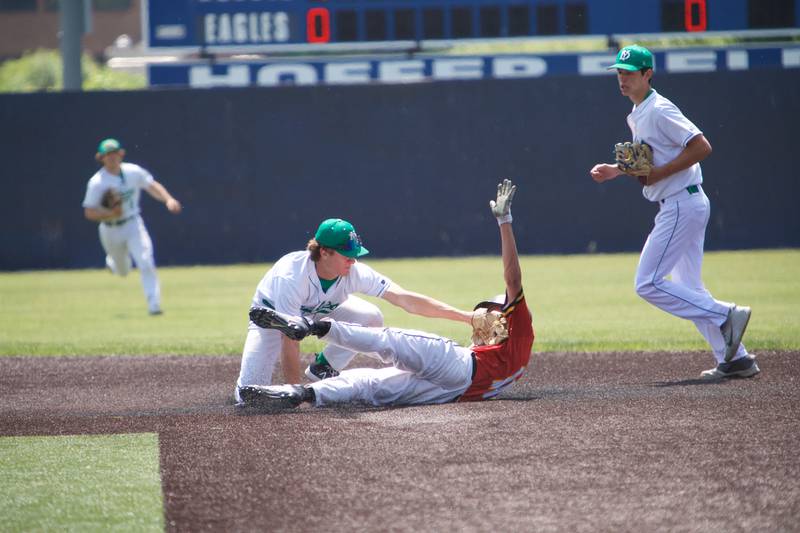 York's Josh Fleming tags out Batavia's Andrew Gorski at the Class 4A Sectional Final on Saturday, June 3, 2023 in Elgin.