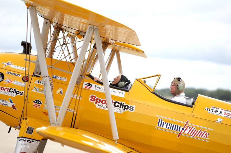 Helen Ehlers, 99, of Wheaton (left) and pilot Darryl Smith prepare to take off for a Dream Flight at the DuPage Airport in West Chicago on Saturday, July 29, 2023. The plane is a 1942 open cockpit Boeing Stearman, the same airplane used to train military aviators in the 1940s. The flights were courtesy of Ageless Aviation Dreams Foundation, a non-profit organization to honor U.S. military veterans living in long-term care facilities.