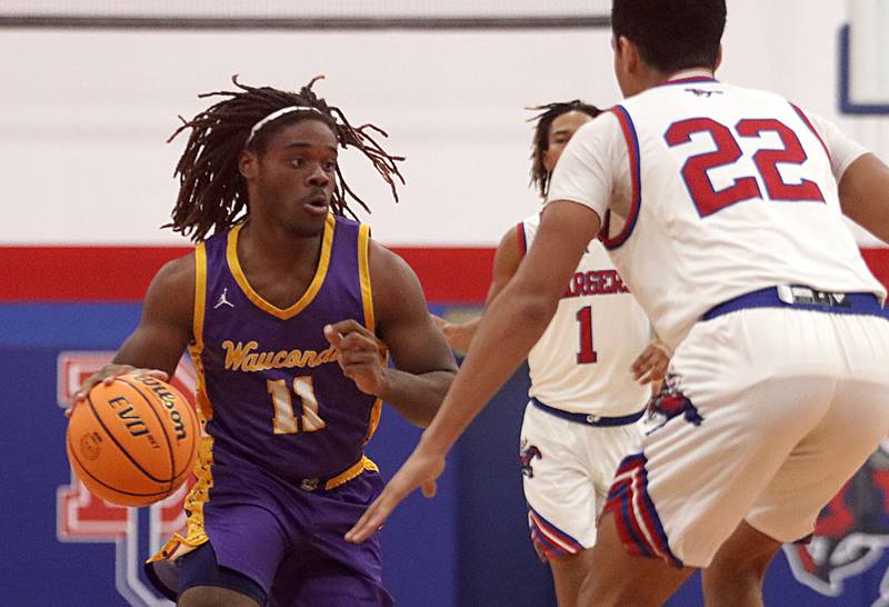 Wauconda’s Kaden Pemberton moves the ball in varsity basketball Friday, Dec. 20, 2024 at Dundee-Crown High School in Carpentersville.